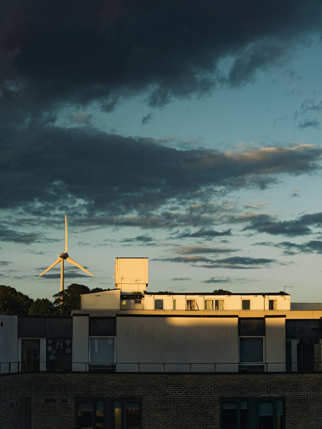 our-story Windmill at Lancaster University, with afterglows shining on the building structure