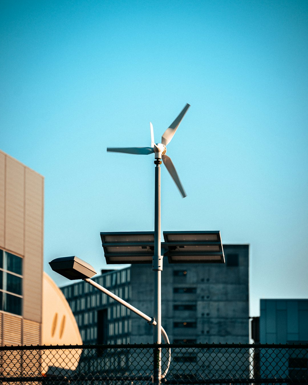 services-img-01 a-wind-turbine-on-top-of-a-metal-pole-xxmt1vpfr48