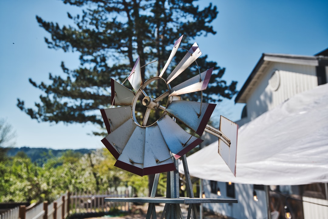 cta-image a-windmill-on-a-pole-in-front-of-a-house-q2fjt6e7ag