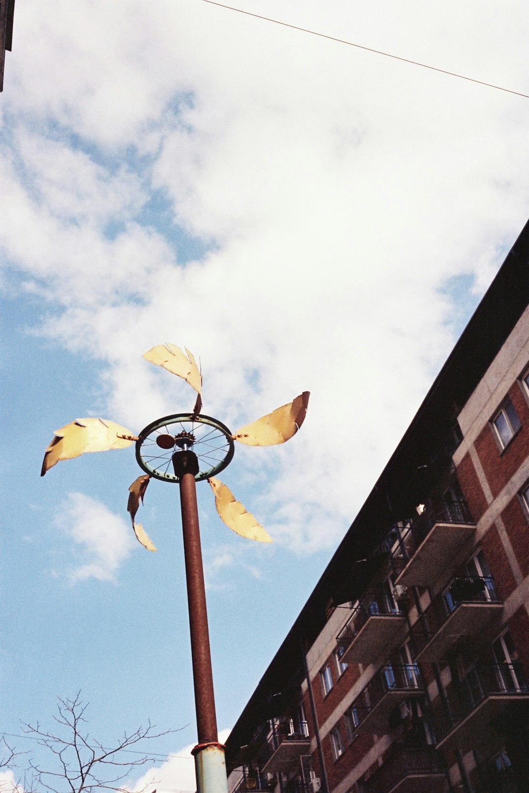 why-choose-us-img a-windmill-sculpture-against-a-cloudy-sky-wo1gw-bqhuw
